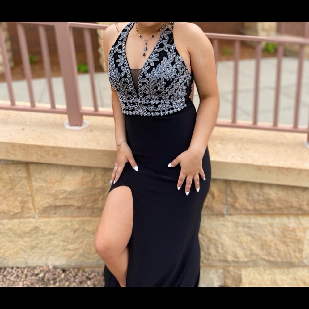 I’m selling my prom dress. Its black and silver (size 5), I bought it from macys